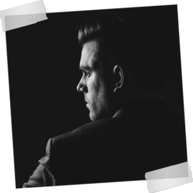 Portrait of a man taken over his left shoulder